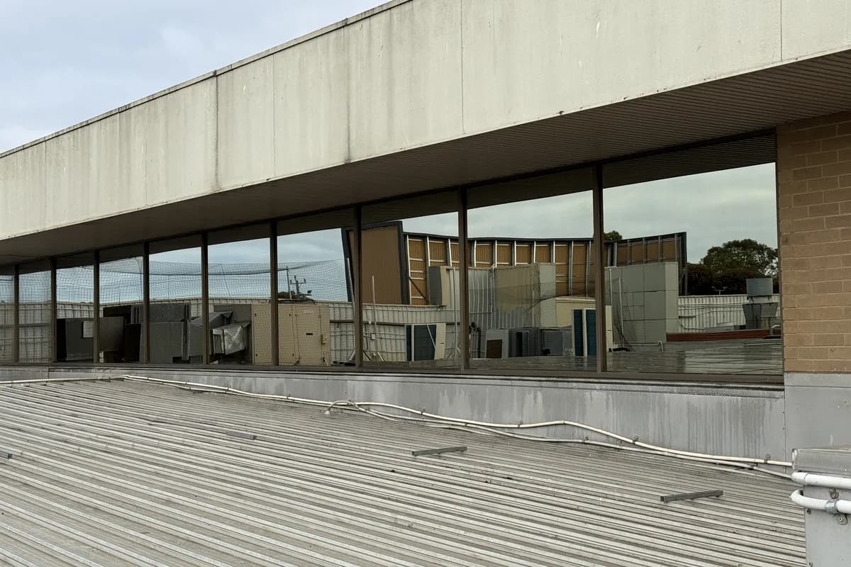 Recent job: a long run of clean upper-level shopping centre windows above a metal roof
