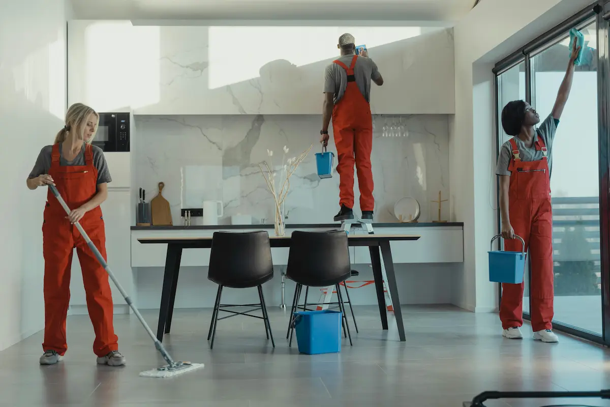 Cleaners at work in a bright modern home